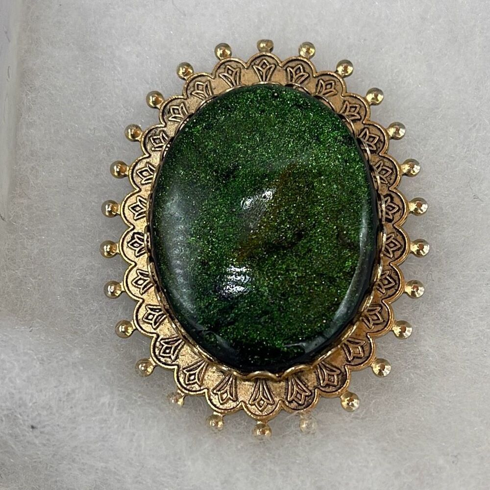 Vintage Green sparkling resin type cabochon brooch.